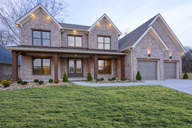Huge minimalist two-story mixed siding house exterior photo in Louisville with a hip roof, a shingle roof and a brown roof