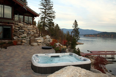 Inspiration for a mid-sized timeless backyard concrete paver and rectangular aboveground hot tub remodel in Los Angeles