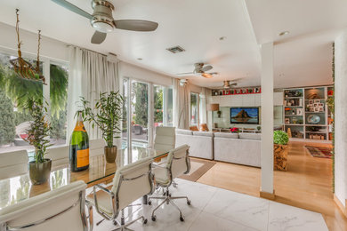 Example of a huge eclectic home design design in Miami