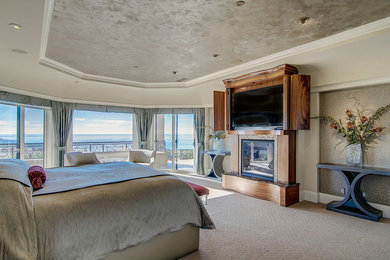 Bedroom - traditional master carpeted and beige floor bedroom idea in Orange County with beige walls, a standard fireplace and a tile fireplace