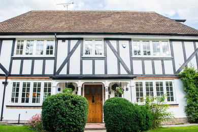 Photo of a traditional home design in Surrey.