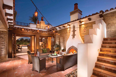 This is an example of a mediterranean courtyard patio in Los Angeles with no cover.