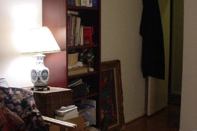 Example of a mid-sized medium tone wood floor home studio design in DC Metro with beige walls