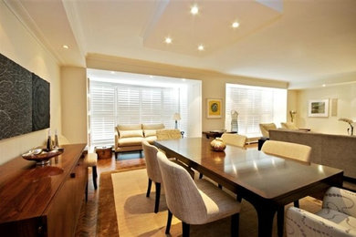 Great room - large contemporary dark wood floor great room idea in Toronto with beige walls