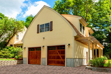 Mid-sized contemporary yellow two-story wood exterior home idea in Boston