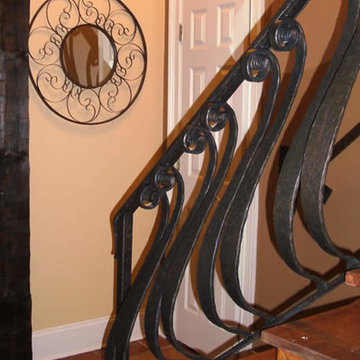 Hand forged hand rail with old world patina finish