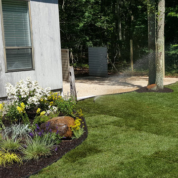 Backyard Makeover Installing Sod, Privacy Hedge, Flower Garden, Gravel Driveway