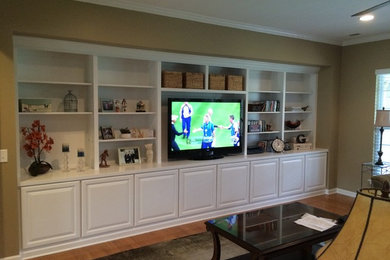 Mid-sized elegant open concept light wood floor and beige floor living room photo in Charlotte with brown walls, no fireplace and a tv stand