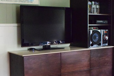 Example of a mid-sized minimalist light wood floor bedroom design in New Orleans with green walls and no fireplace