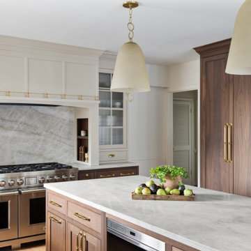 Elegant Two-Tone Kitchen with Walnut Cabinetry and Statement Stone Backsplash