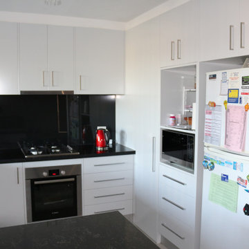 White kitchen cabinets with handles