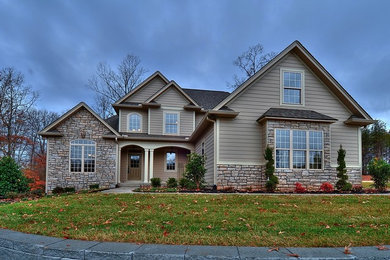 Inspiration for a large transitional multicolored two-story mixed siding exterior home remodel in Other with a shingle roof