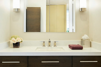 Bathroom - small modern master beige tile and porcelain tile porcelain tile and beige floor bathroom idea in Chicago with flat-panel cabinets, dark wood cabinets, a two-piece toilet, beige walls, an undermount sink and quartzite countertops