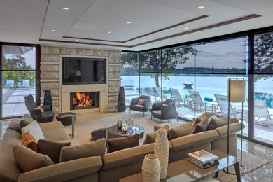 Contemporary living room in Detroit with a standard fireplace and a stone fireplace surround.
