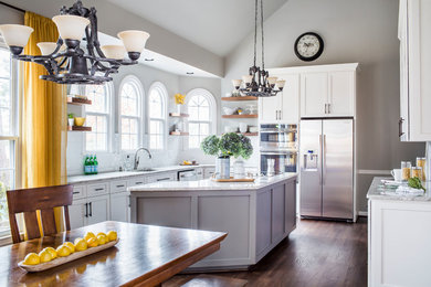 Transitional u-shaped medium tone wood floor and brown floor eat-in kitchen photo in Atlanta with an undermount sink, shaker cabinets, gray cabinets, stainless steel appliances, an island and beige countertops