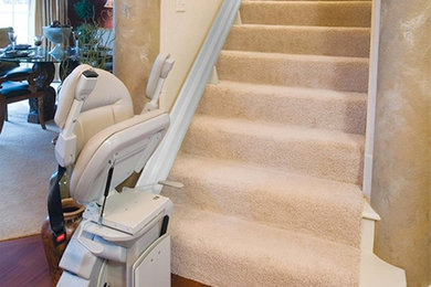 Mid-sized elegant carpeted straight staircase photo in Houston with carpeted risers