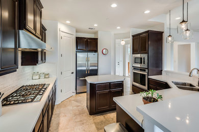This is an example of a transitional kitchen in Sacramento.