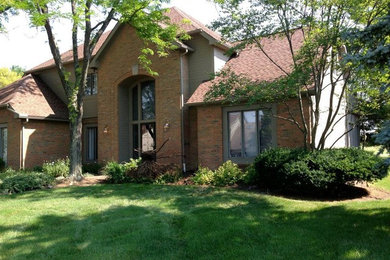 This is an example of a large traditional partial sun front yard landscaping in Columbus for spring.