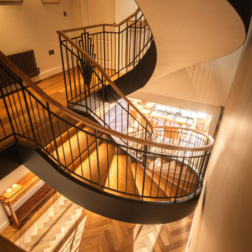 Cambridge - Feature Circular Staircase with Spindle Art Deco Design Balustrade