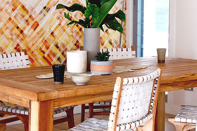 Beach style open plan dining in Central Coast with yellow walls, light hardwood floors and beige floor.