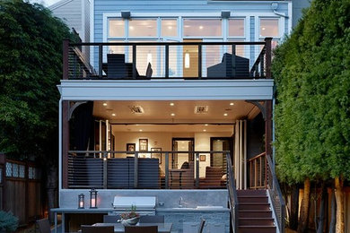 Inspiration for a mid-sized transitional backyard stone patio remodel in San Francisco with a fire pit and no cover