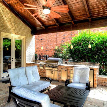 Grand home addition with outdoor kitchen see through fireplace - km