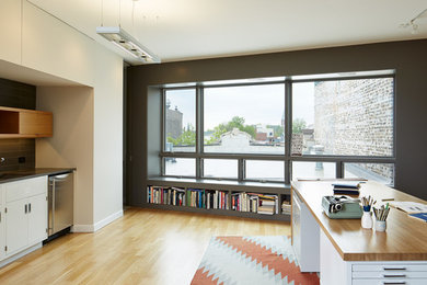 Small minimalist open concept light wood floor living room photo in Chicago