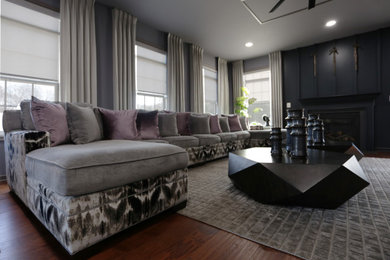 Family room - mid-sized contemporary open concept medium tone wood floor and brown floor family room idea in DC Metro with white walls and a wall-mounted tv