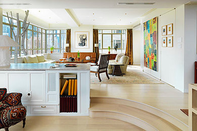 Inspiration for a mid-sized transitional loft-style and formal light wood floor living room remodel in New York with white walls, no fireplace and no tv
