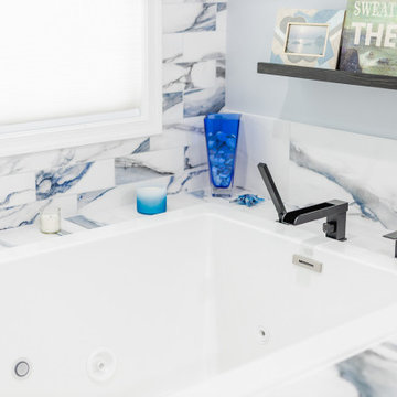 Bathroom remodeling in Columbia, MD with double vanity & marble bathtub