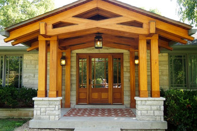 Photo of a mid-sized arts and crafts front door in Louisville with a single front door and a glass front door.