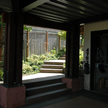 Garage entry below upper terrace