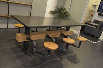 Inspiration for a mid-sized industrial dark wood floor and brown floor kitchen/dining room combo remodel in San Diego with gray walls and no fireplace