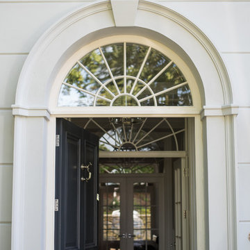 Dwelling with a formal symmetrical front located in a mature wooded site