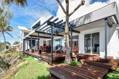 Photo of a beach style two-storey exterior in Sunshine Coast.