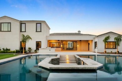 Inspiration for a contemporary tile and custom-shaped pool remodel in Phoenix