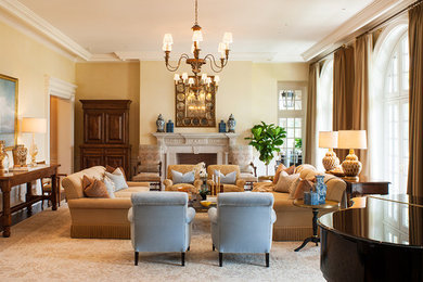 Elegant formal dark wood floor living room photo in New York with a standard fireplace, a stone fireplace and no tv