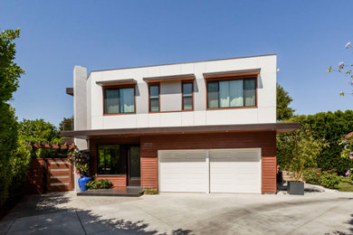 Mid-sized minimalist white two-story wood exterior home photo