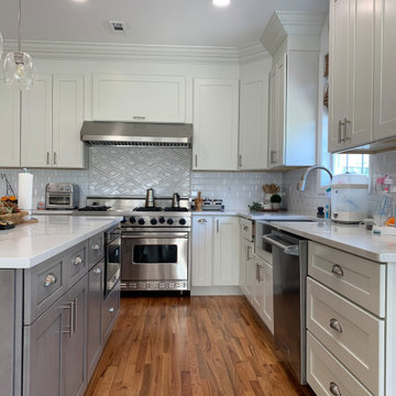 white shaker kitchen cabinets combine with grey shaker cabinets .