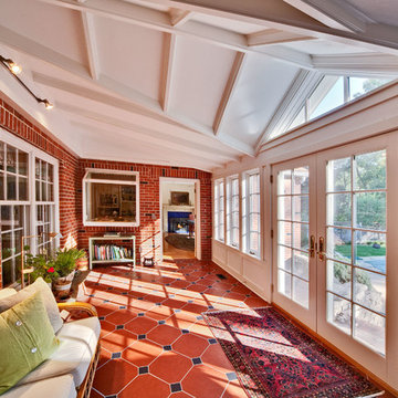 Traditional style sunroom includes French doors and French casement windows