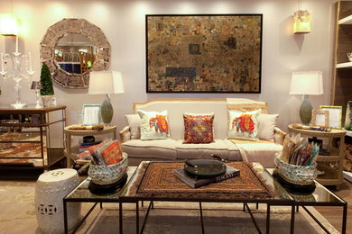Mid-sized eclectic open concept medium tone wood floor living room photo in Miami with white walls