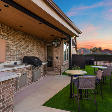Custom Outdoor Living Pool Deck with Stamped Concrete & Turf
