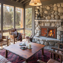 Screened in porch with fireplace