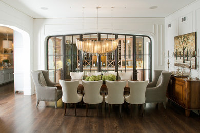Dining room - huge transitional dark wood floor dining room idea in Chicago with white walls