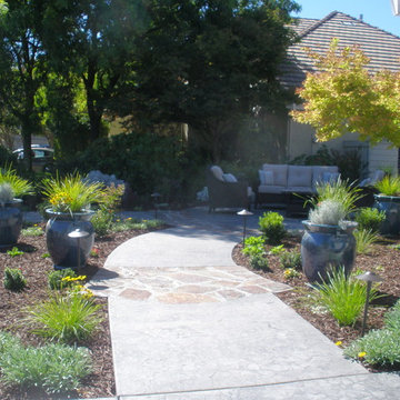 Borrowing the neighbor's yard as the backdrop for the seating area.