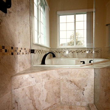 Master Bathroom with Frameless Shower and Jetted Tub