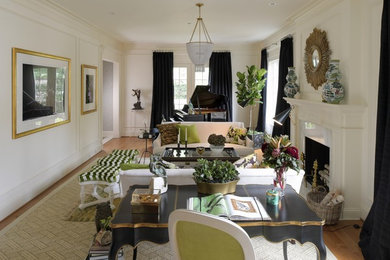Large eclectic formal and enclosed light wood floor living room photo in DC Metro with white walls, a standard fireplace and a wood fireplace surround