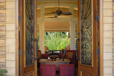 Entryway - mid-sized transitional ceramic tile entryway idea in San Diego with beige walls and a medium wood front door