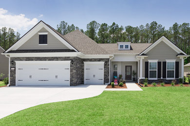 Example of a transitional one-story exterior home design
