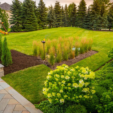 Entertain in this Backyard Landscape with Patio & Firepit: Perfect for Families!
